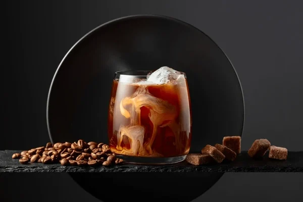 iced-coffee-cream-on-black-600nw-2470148255